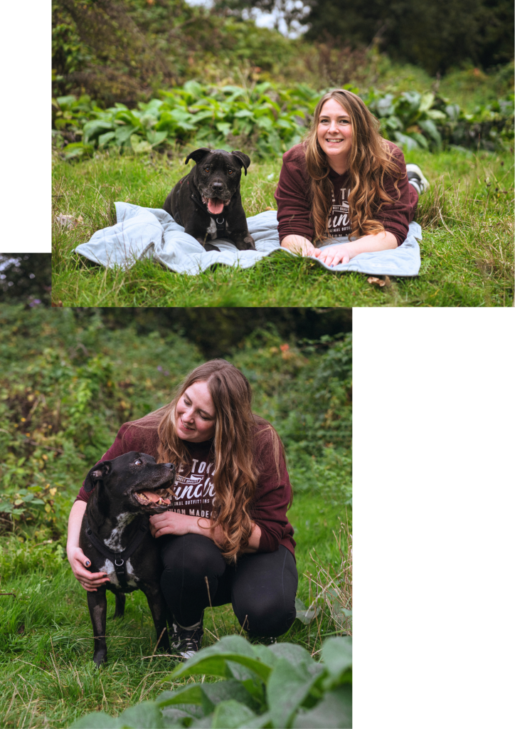 A two-photo collage featuring Holly spending time outdoors with a short-haired black dog, Riggs. Top photo: Holly wearing a maroon sweatshirt lies on her stomach on a light blue blanket spread over green grass next to a short-haired black dog, Riggs lying down beside her. Bottom photo: The same woman crouches on the grass while lovingly wrapping her arm around the short-haired black dog, Riggs who is looking up toward her with its tongue out.